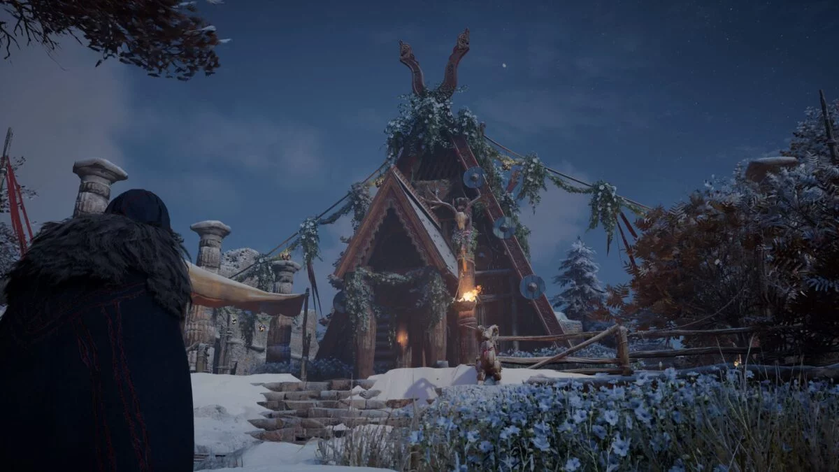 Eivor steht in Assassin's Creed Valhalla vor dem Haus des Beraters in Eoforwic.