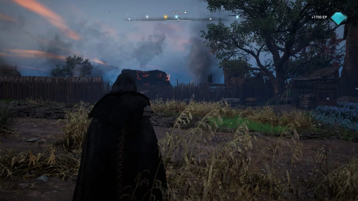 Eivor blickt auf das Dorf Waledene in Assassin's Creed Valhalla.