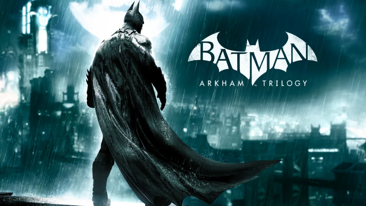 Batman schaut im Regen auf Gotham hinab.
