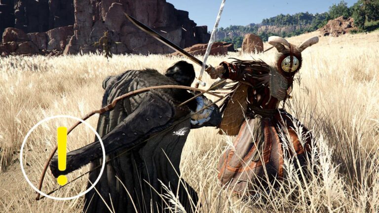 Two men are locked in battle on a field.