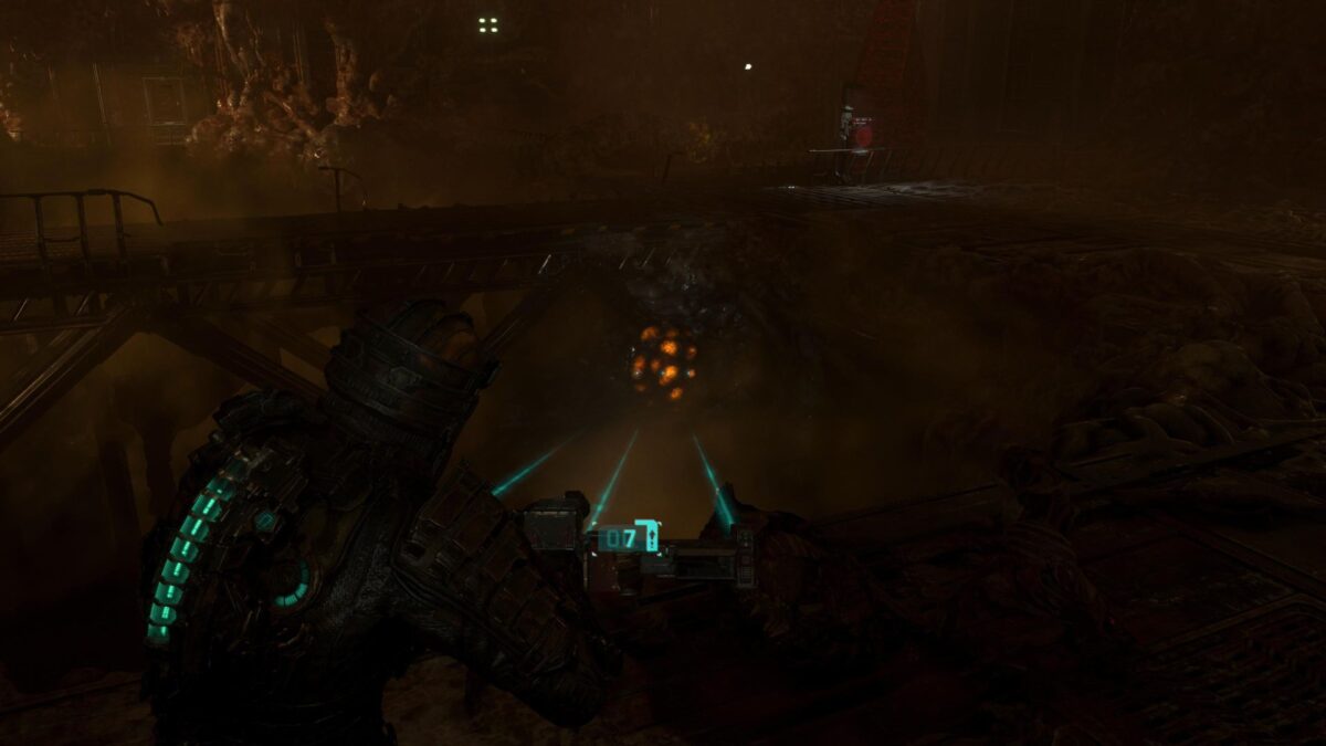 Isaac zielt in Dead Space auf ein leuchtendes Geschwulst unter einer Brücke.