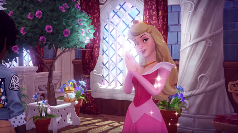 Aurora in einem rosa glitzernden Kleid, hält die Handflächen aneinander und lächelt.