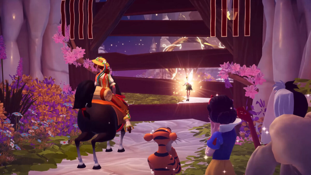 A girl is sitting on a horse and standing in front of several wooden boards that are blocking the passage.