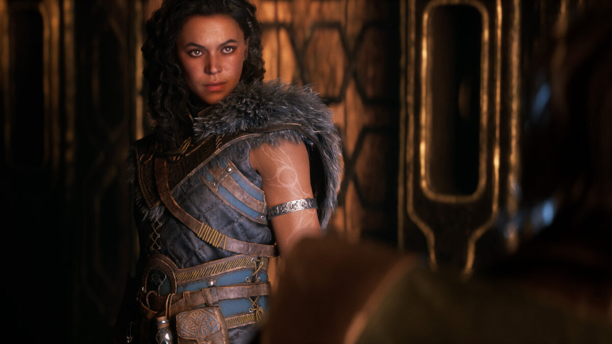 A fierce-looking female warrior in a fantasy setting.