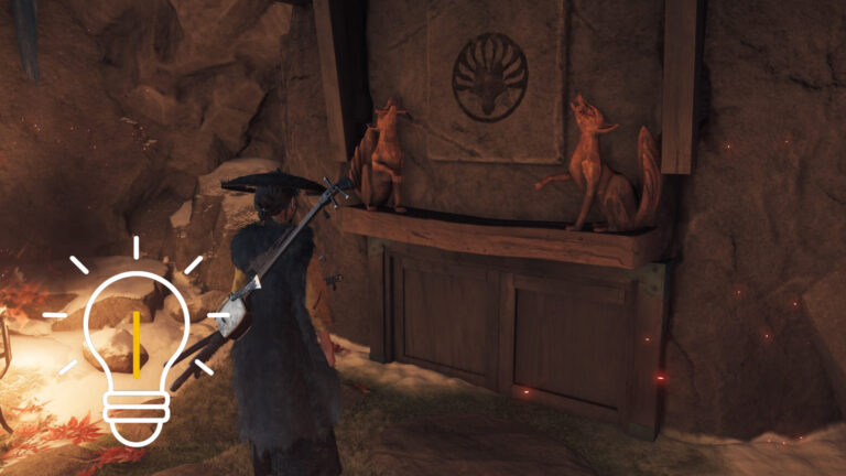 Atsu stands in front of two fox statues.