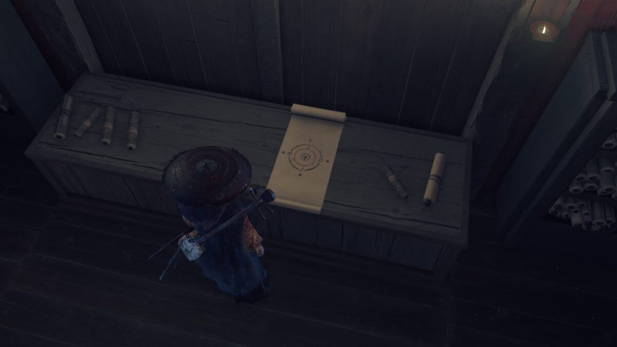 Atsu stands at a table with a scroll covered in symbols.