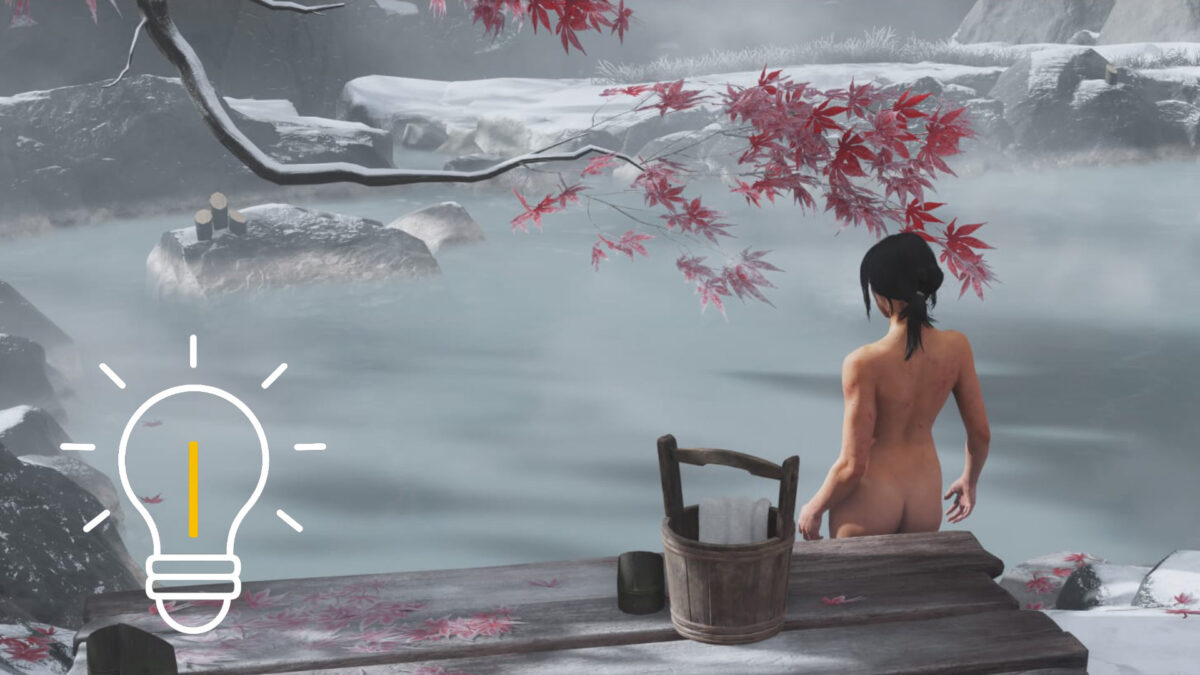 Atsu steps into a hot spring, above which are some branches with red leaves on them.