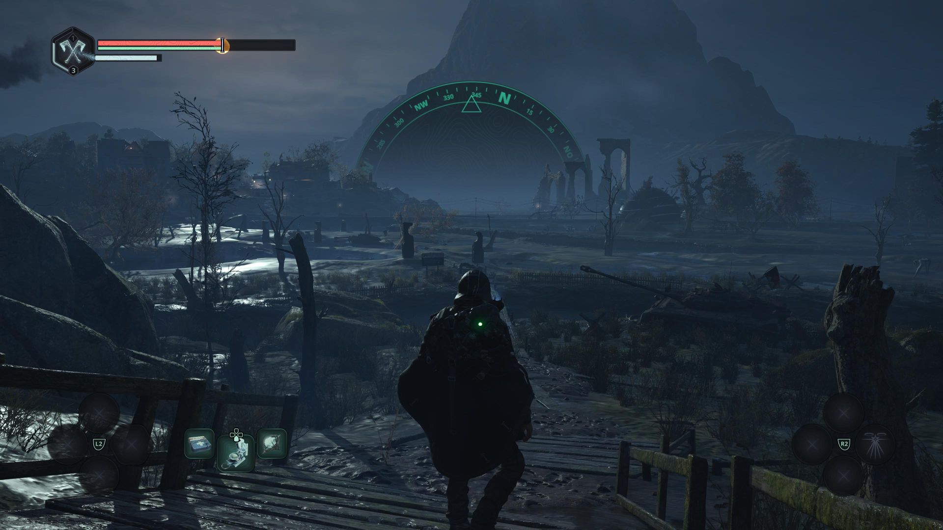 A man in a rain poncho stands on a bridge, overlooking the vast expanse of a swamp.