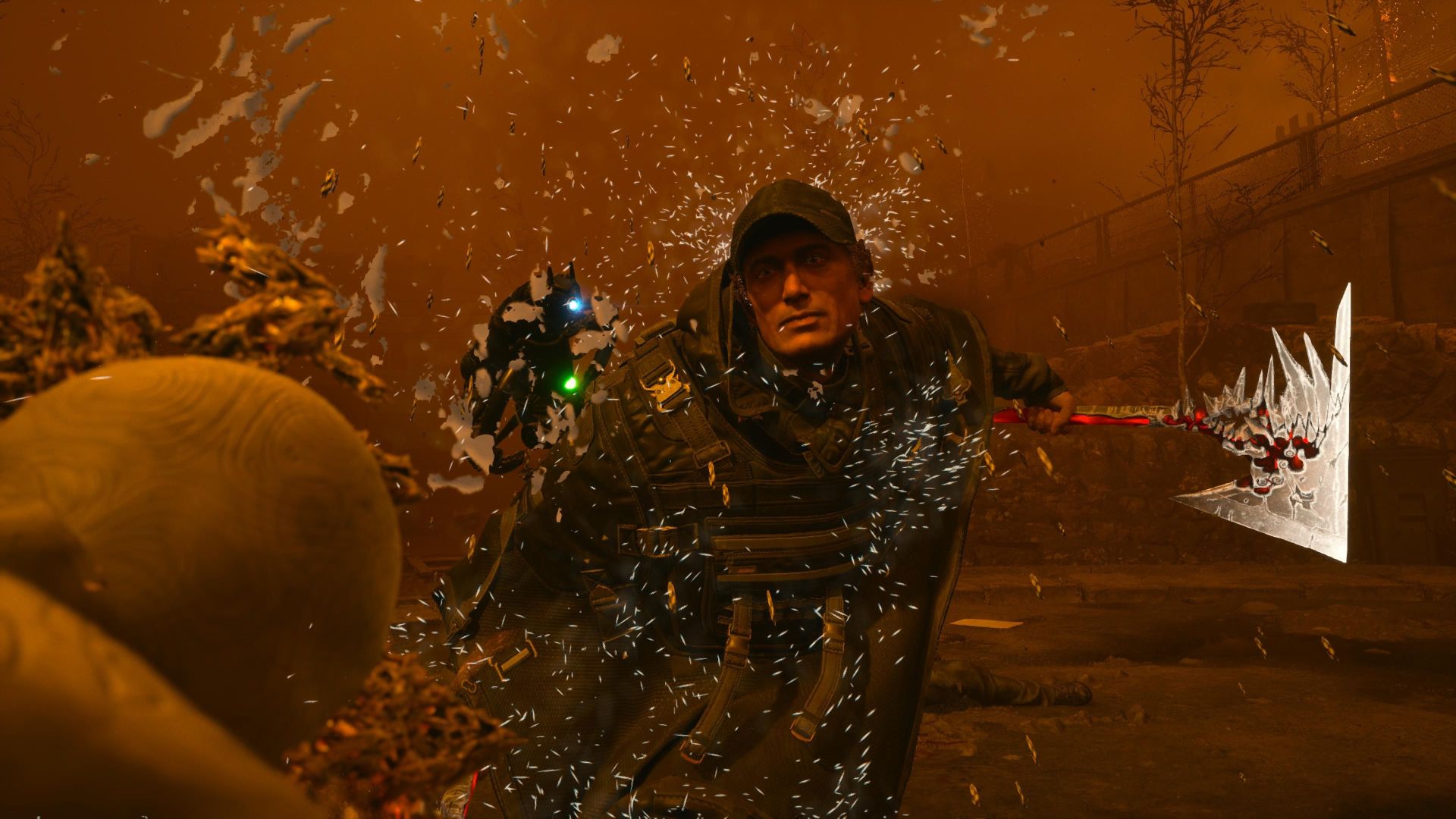 A man wearing a cap and a rain poncho fights a white monster with a hatchet.