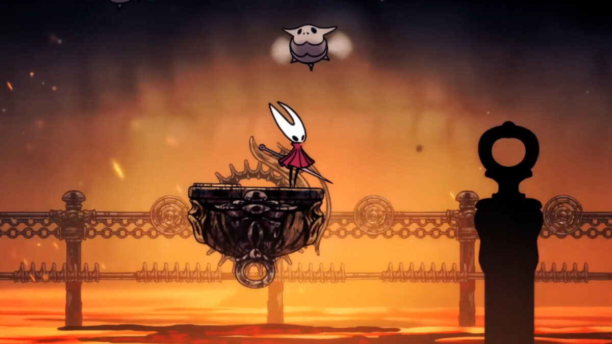 Hornet stands on a moving platform above a fiery area with chains and gears in Hollow Knight: Silksong