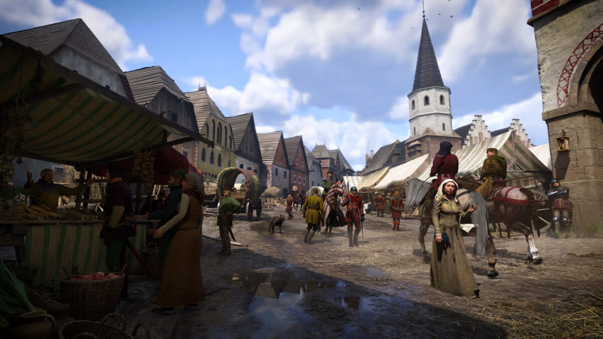 Eine Stadt mit zahlreichen Menschen und einem Markt in Kingdom Come: Deliverance 2.