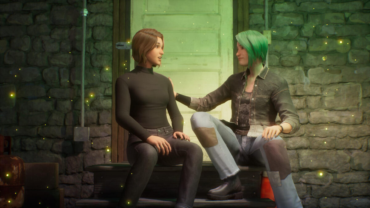 Max und Chloe sitzen vor einer Tür nebeneinander.