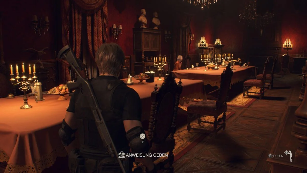 Leon und Ashley setzen sich an reich gedeckte Tische im Speisesaal von Resident Evil 4 Remake. 