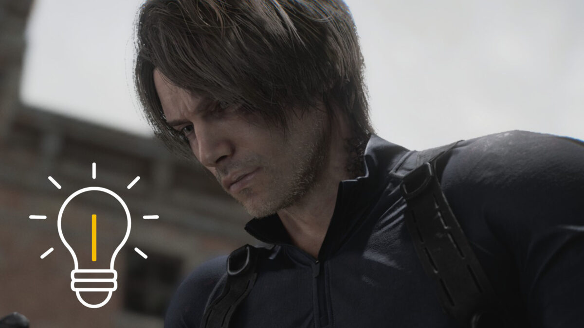 Leon von der Seite, während er zu einem Handy schaut.