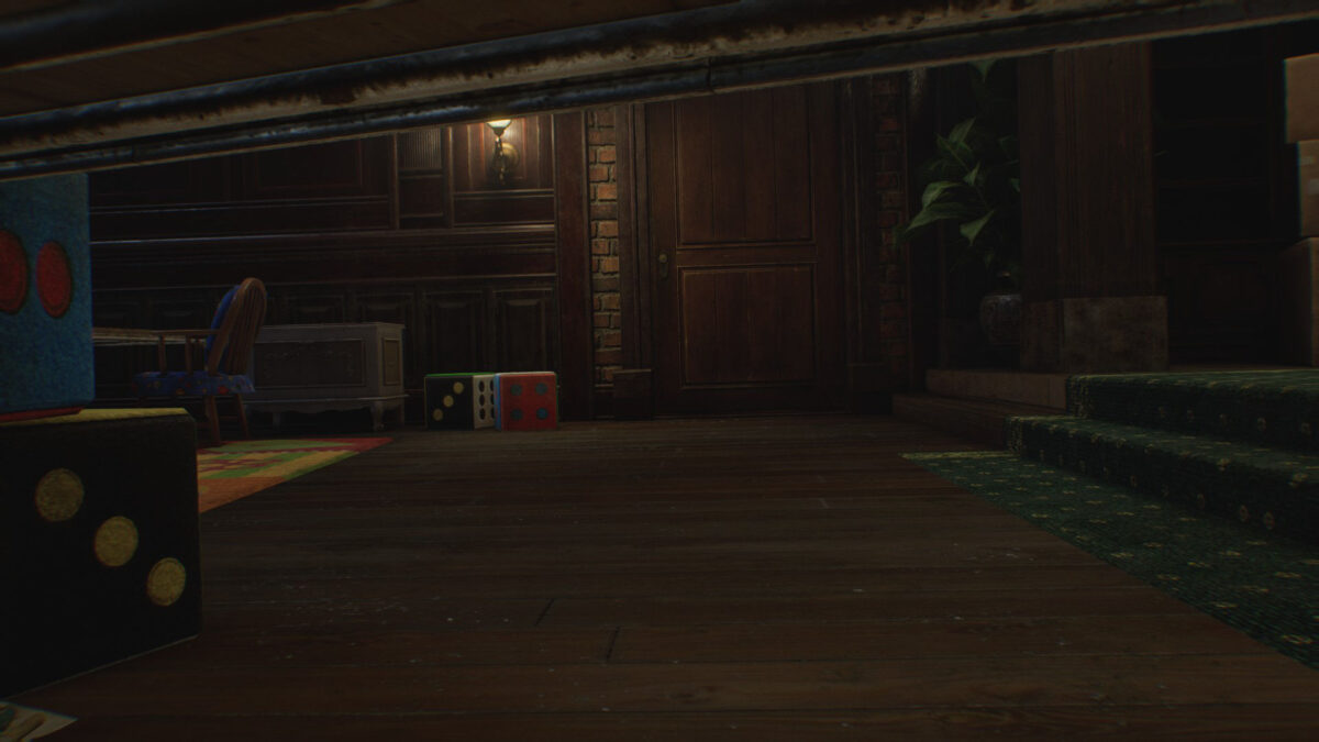 Chloes Sicht unter dem Tisch auf eine Holztür.