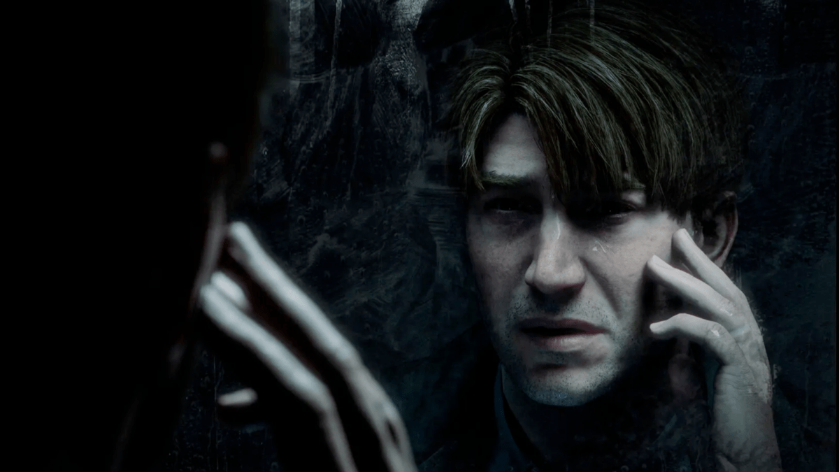 Silent Hill 2-Protagonist James Sunderland schaut in einen Spiegel.