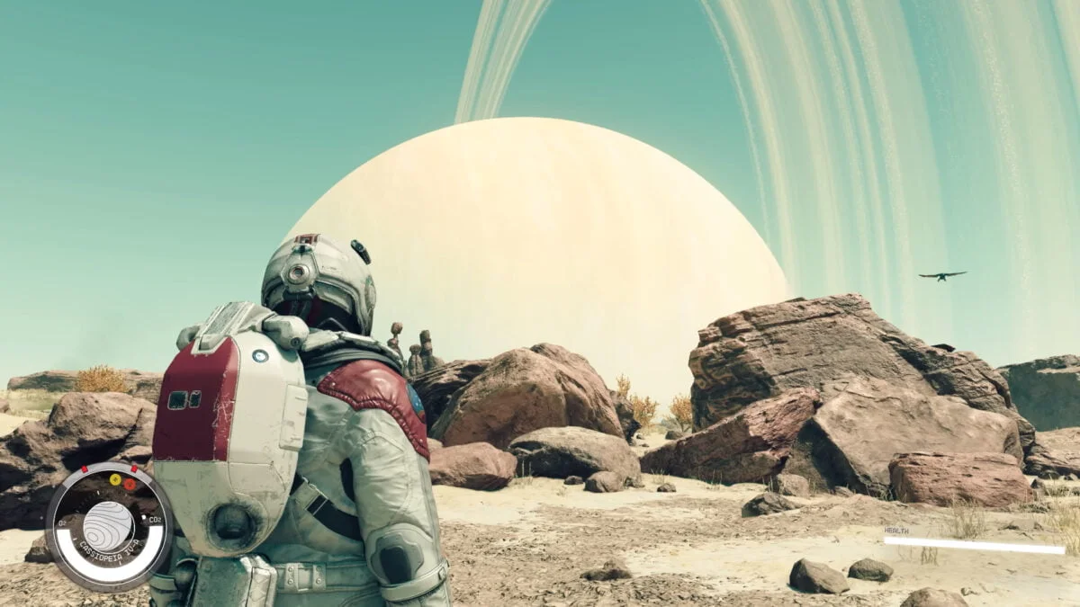 Ein Astronaut geht in Starfield auf einem fremden, felsigen Planeten spazieren.