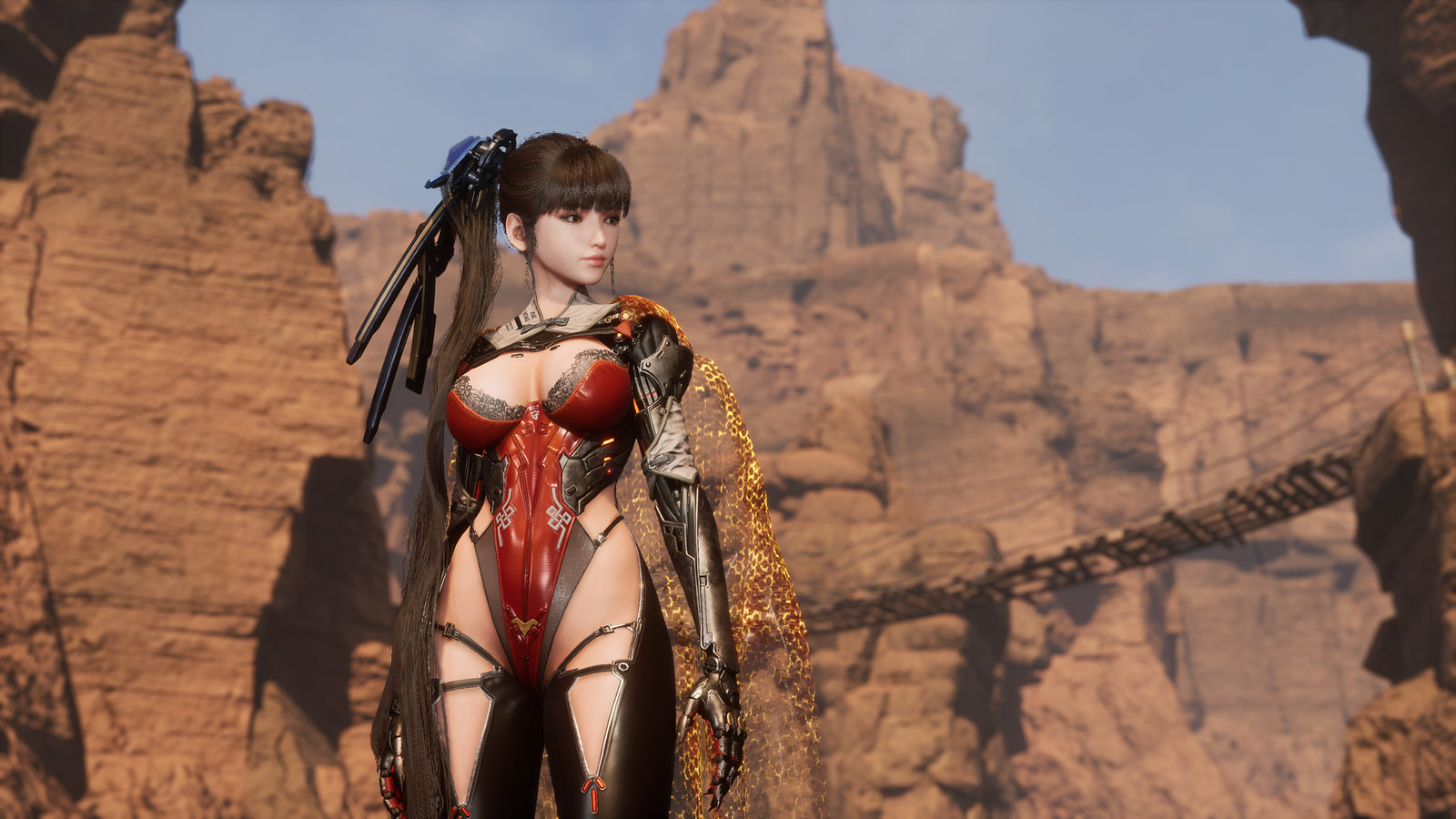 Protagonistin Eve in einem roten Kostüm vor einer Felswand in Stellar Blade.