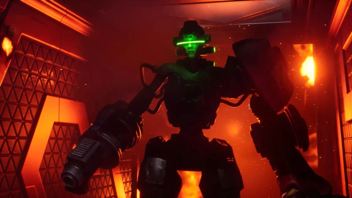 Ein Screenshot aus System Shock Remake zeigt einen Kampfroboter mit grünem Gesicht.