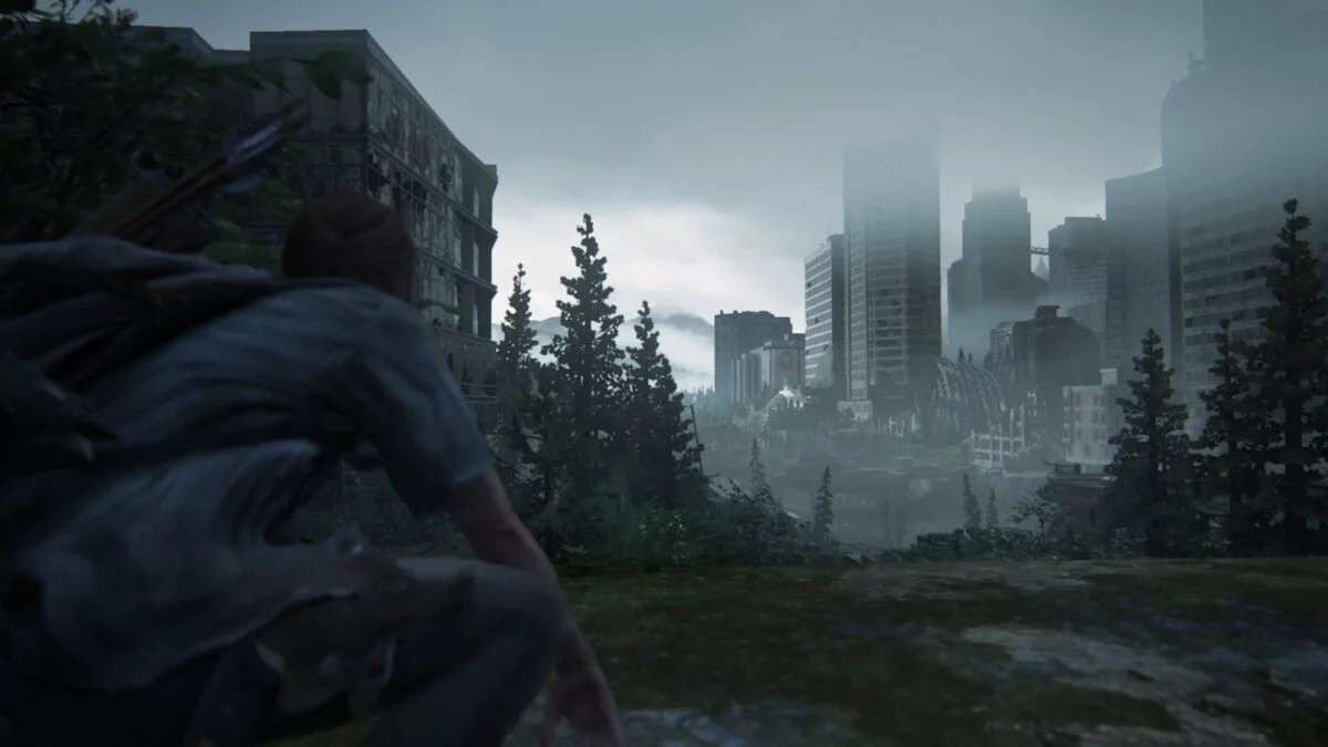 Ellie blickt auf die Hochhäuser in der Ferne in The Last of Us Part 2.