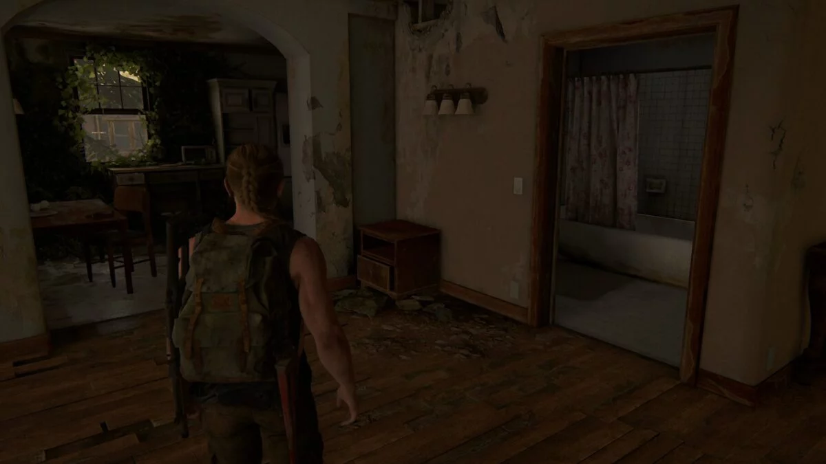 Abby steht in The Last of Us 2 in einem verlassenen Apartment. 