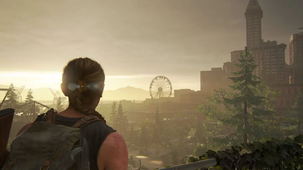 Abby erblickt in The Last of Us 2 das Riesenrad am Horizont.
