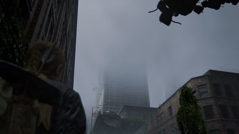 Abby blickt in The Last of Us 2 auf einen Wolkenkratzer.
