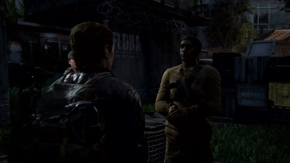 Abby spricht in The Last of Us 2 mit einer WLF-Wache.