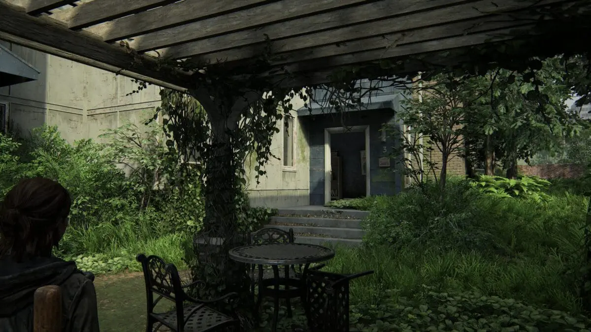 Sitzgelegenheit unter einem Vordach mit Blick auf Haus Nummer 3 in Capitol Hill in The Last of Us 2