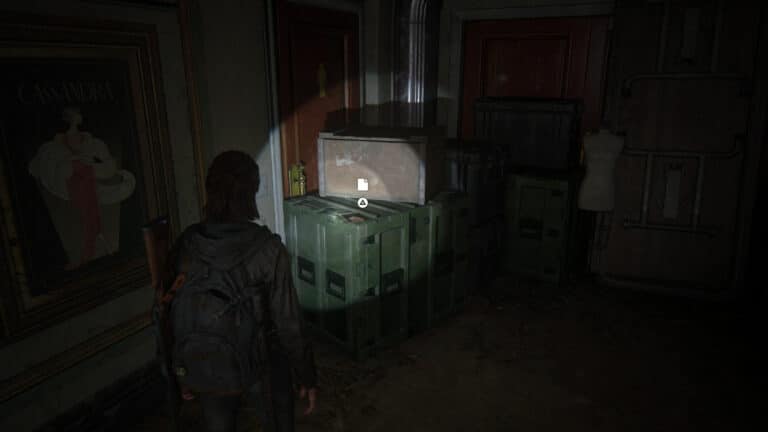 The artifact lies on the green crate outside the men´s room.