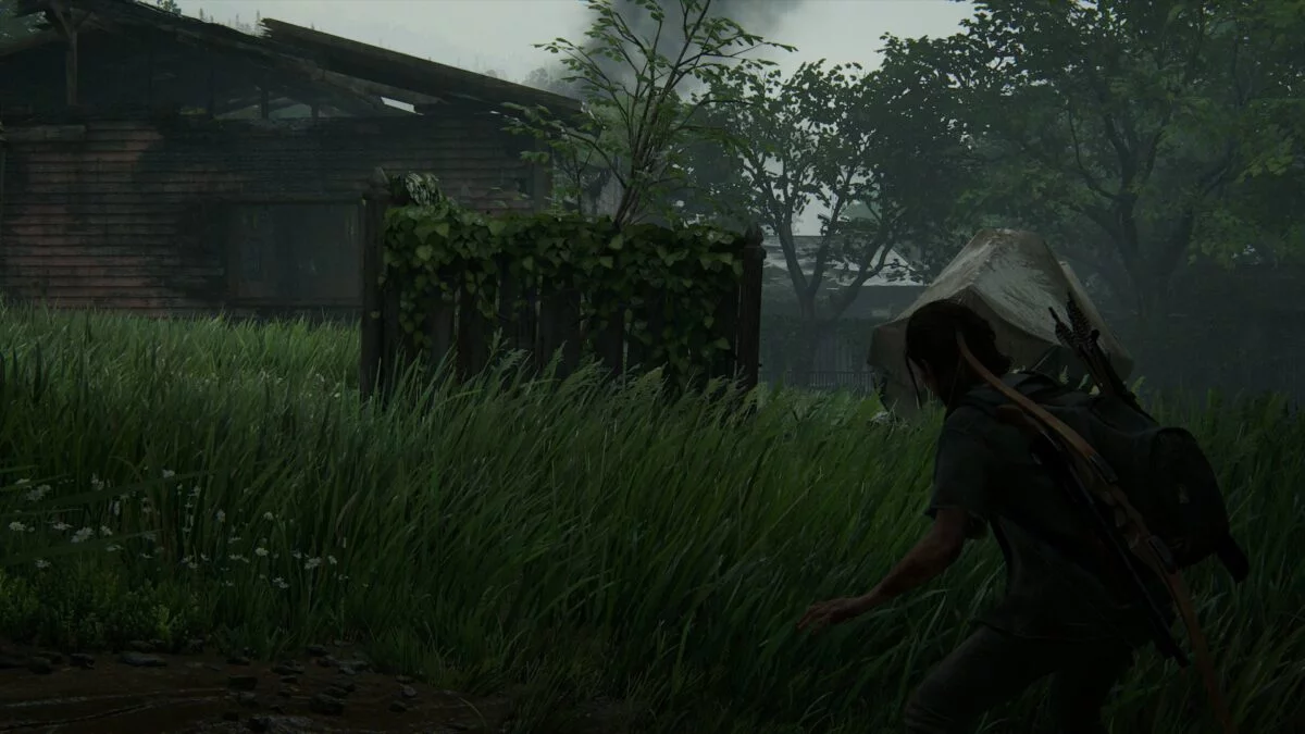 Ellie in kampfbereitschaft an einer Ruine mit Boot in Hillcrest in The Last of Us 2