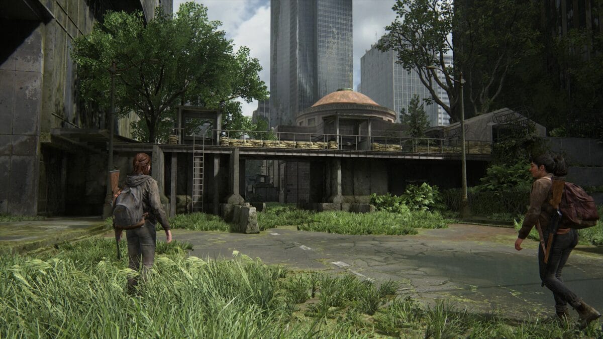 Ellie and Dina walk towards the heavily fortified roadblock in downtown Seattle.