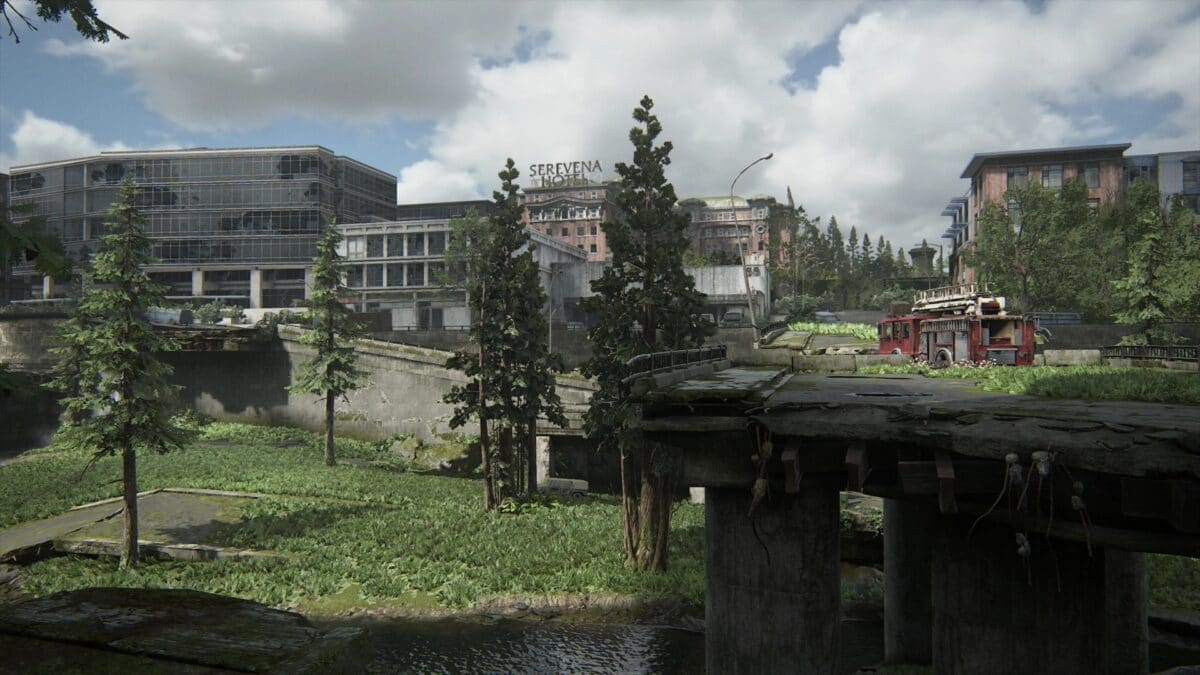 View over a destroyed highway in The Last of Us 2 with a fire truck on it