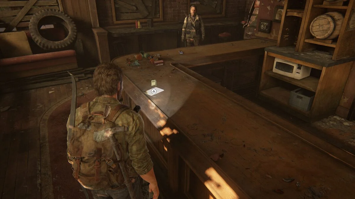 Das erste Trainingsbuch in The Last of Us Part 1 liegt am Tresen in Bills Unterschlupf.