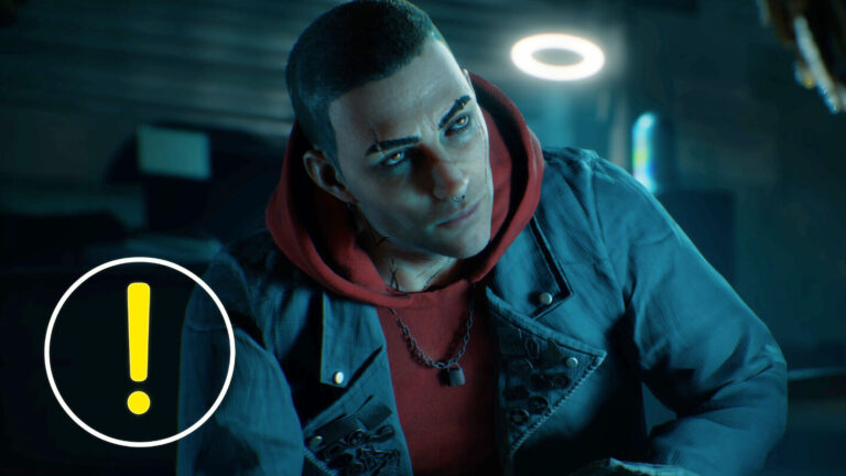Ein düsteres Szenenbild aus Vampire: The Masquerade – Bloodlines 2 zeigt einen Vampir mit kurz geschorenen Haaren, Piercing und leuchtenden Augen, der in einem schwach beleuchteten Raum sitzt. Er trägt eine rote Kapuzenjacke unter einer Jeansjacke mit Ansteckern. Links im Bild ist ein gelbes Ausrufezeichen-Symbol zu sehen.