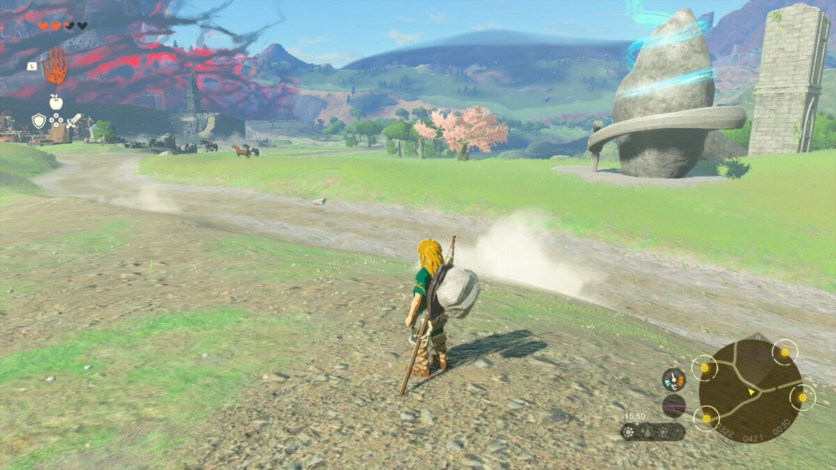 Link beobachtet in Zelda: Tears of the Kingdom eine Herde Wildpferde auf einer Wiese.
