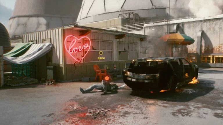 Cyberpunk 2077 Kleidung-Guide Konzerner-Leiche liegt neben ausgebranntem Auto vor Container-Haus mit Neon-Love-Schild