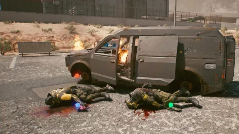 Cyberpunk 2077 Kleidung-Guide Zwei gerüstete Leichen neben einem brennenden Militech-Van