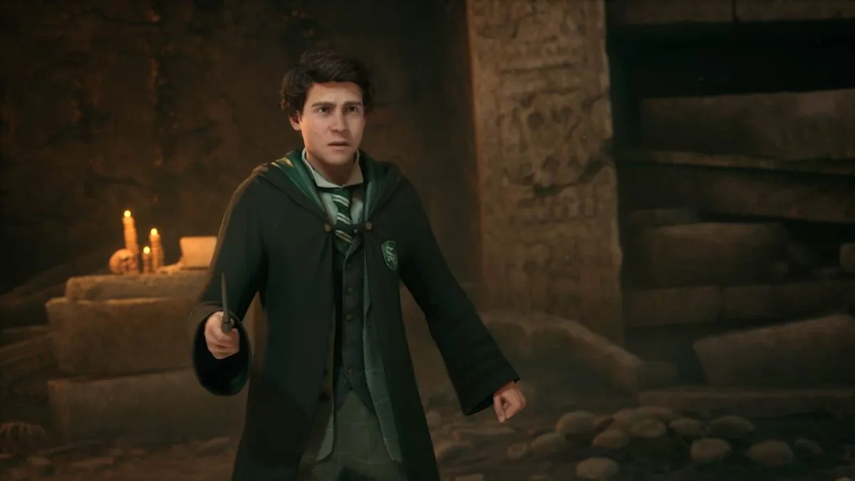 Ein Zauberer von Hogwarts Legacy, mit einem Zauberstab in der Hand.