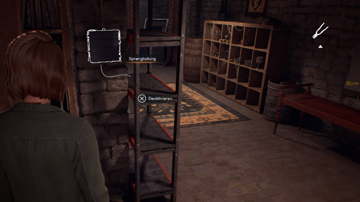 Max steht vor einer Sprengladung an einer Wand.